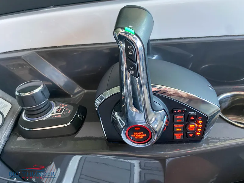 Slide: The Image of 2023 Monterey 298SS boat throttle and control panel. - 20