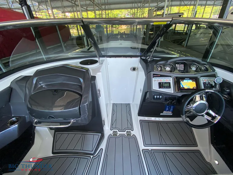 Slide: The Image of 2023 Monterey 298SS boat cockpit with modern dashboard and steering wheel. - 25