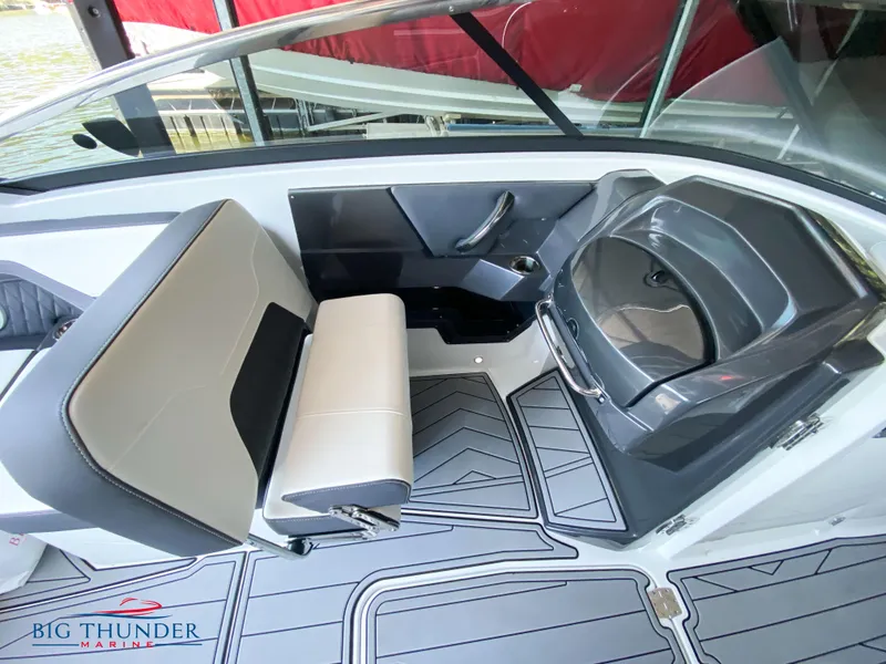 Slide: The Image of 2023 Monterey 298SS boat interior with seating and storage compartments. - 27
