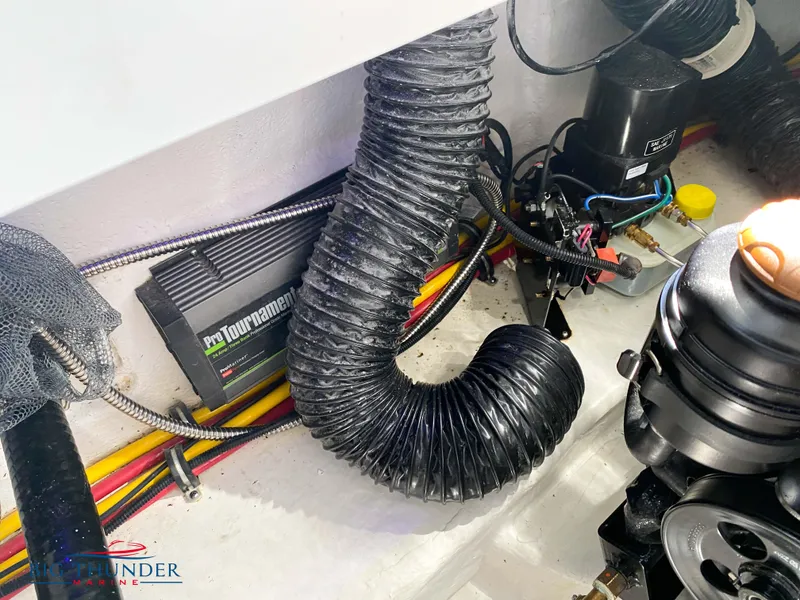 Slide: The Image of Engine compartment of a 2023 Monterey 298SS boat with wiring and ventilation hose. - 40