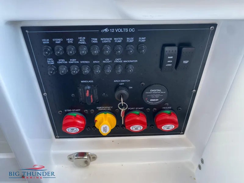 Slide: The Image of Control panel of a 2023 Monterey 298SS boat with various switches and indicators. - 13