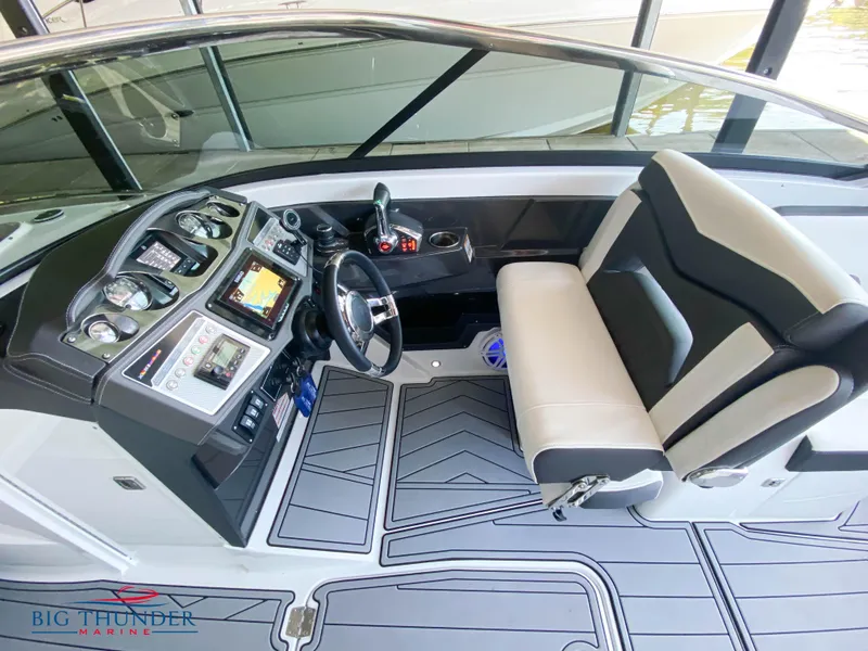 Slide: The Image of 2023 Monterey 298SS boat cockpit with modern controls and comfortable seating. - 16