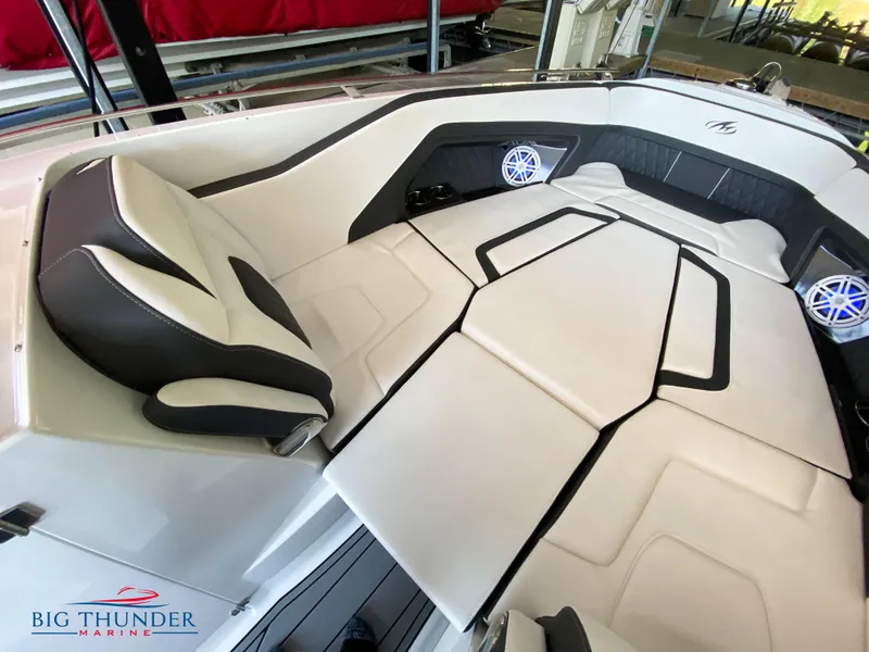 Slide: The Image of 2023 Monterey 298SS boat interior with white and black seating, Big Thunder Marine. - 33