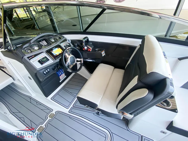 Slide: The Image of 2023 Monterey 298SS boat cockpit with modern controls and comfortable seating. - 15