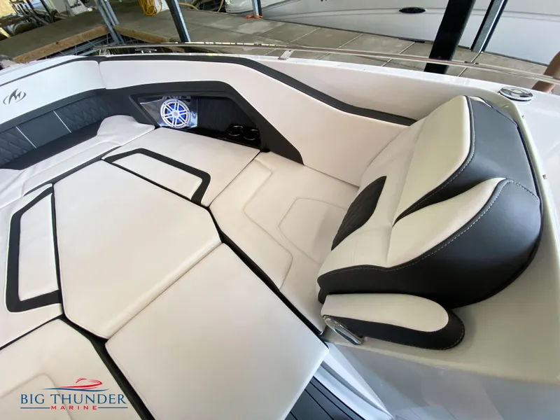 Slide: The Image of 2023 Monterey 298SS boat interior with white and black seating, Big Thunder Marine logo. - 34