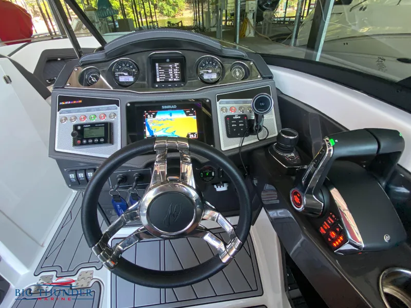 Slide: The Image of 2023 Monterey 298SS boat dashboard with advanced navigation and control systems. - 17
