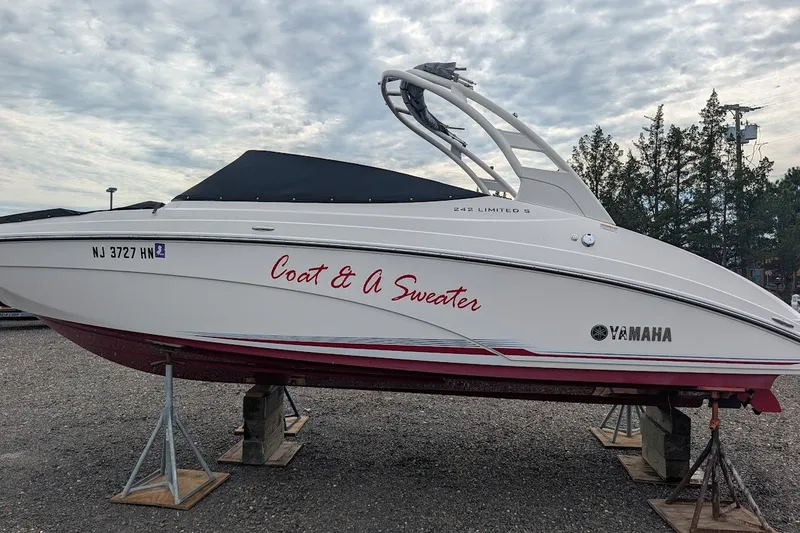 Slide: The Image of 2019 Yamaha Boats 242 Limited S on stands, featuring "Coat & A Sweater" text. - 27