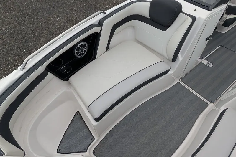 Slide: The Image of 2019 Yamaha Boats 242 Limited S interior with white seating and cup holders. - 20