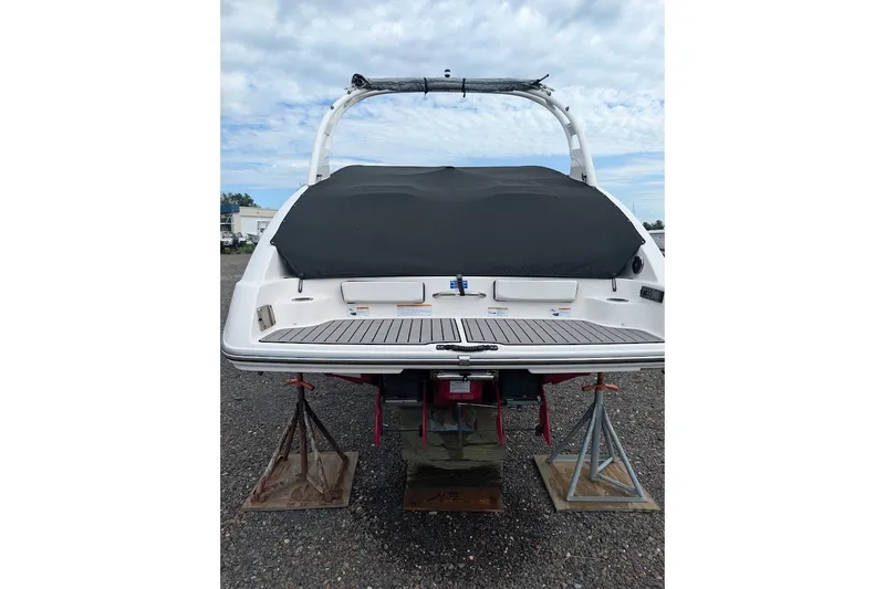 Slide: The Image of 2019 Yamaha Boats 242 Limited S on stands, rear view with cover. - 26