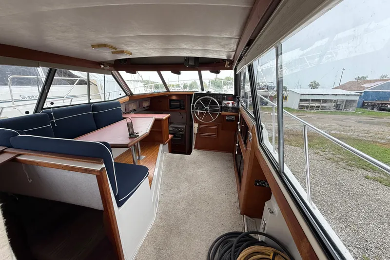 Slide: The Image of Interior of a 1987 Bayliner 3270 Motoryacht with seating and helm station. - 19