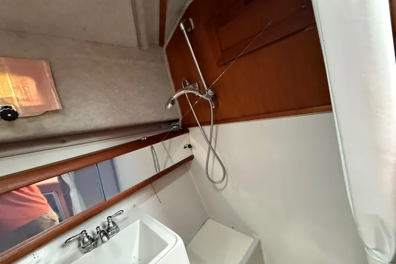 Slide: The Image of Interior of 1987 Bayliner 3270 Motoryacht bathroom with shower and sink. - 29
