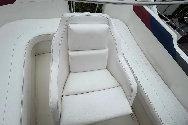 Slide: The Image of White seating on 1987 Bayliner 3270 Motoryacht, featuring sleek design and raindrop details. - 17