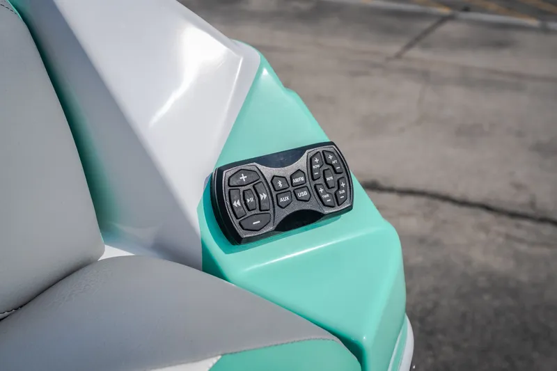 Slide: The Image of Control panel on 2021 Tigé 21ZX boat, featuring audio and navigation buttons. - 14