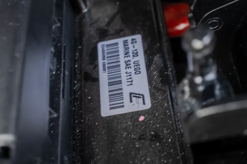 Slide: The Image of Close-up of a 2021 Tigé 21ZX marine engine label with barcode and specifications. - 27