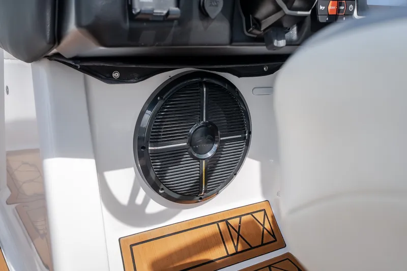 Slide: The Image of Speaker system in 2021 Tigé 21ZX boat interior, featuring sleek design and wood accents. - 22