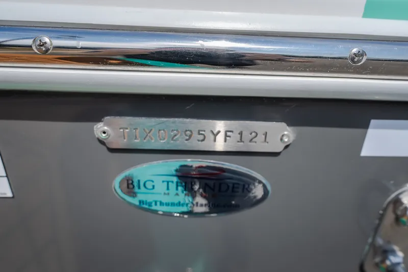 Slide: The Image of 2021 Tigé 21ZX boat with identification plate and Big Thunder Marine logo. - 7