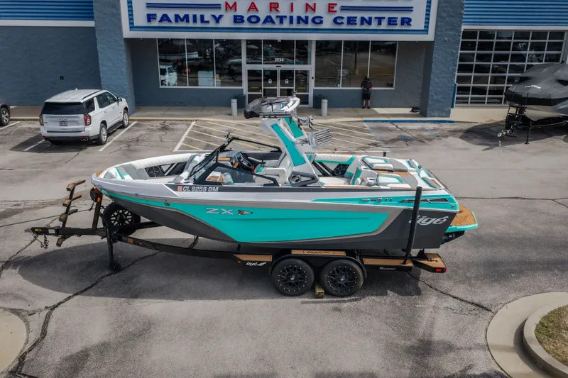 Slide: The Image of 2021 Tigé 21ZX boat on trailer at Marine Family Boating Center. - 47