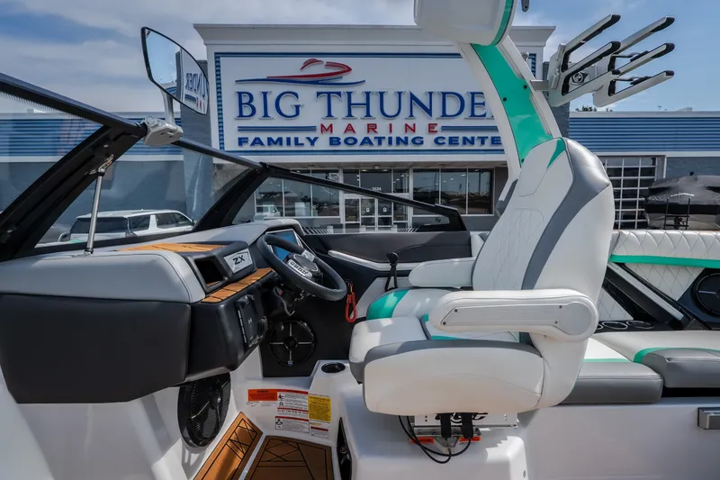 Slide: The Image of 2021 Tigé 21ZX boat interior at Big Thunder Marine dealership. - 23