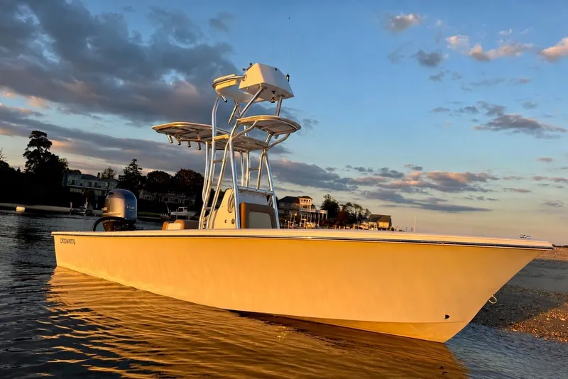 The Image of Croswait 21 boat, 2020 model, anchored at sunset with scenic waterfront background. - 0