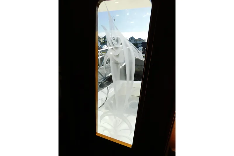 Slide: The Image of Frosted glass door on 1996 Viking 50 Convertible yacht, showcasing intricate design. - 23
