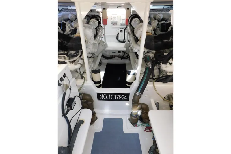 Slide: The Image of Engine room of a 1996 Viking 50 Convertible boat, showcasing machinery and components. - 59