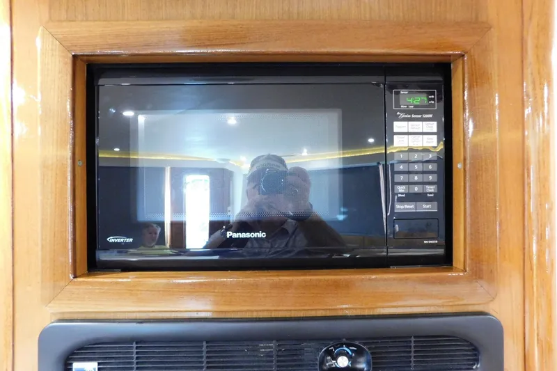 Slide: The Image of Built-in Panasonic microwave in 1996 Viking 50 Convertible yacht kitchen. - 40