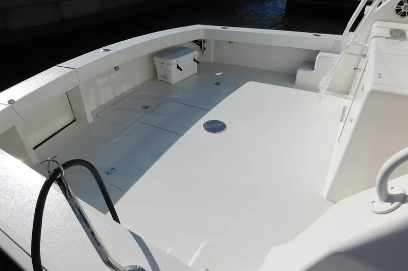 Slide: The Image of Spacious deck of a 1996 Viking 50 Convertible yacht, featuring clean white surfaces. - 20