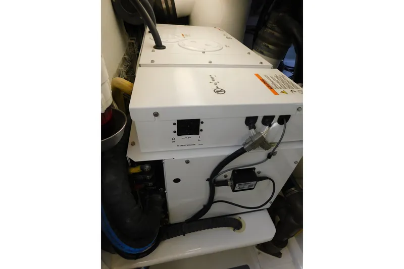 Slide: The Image of Engine room of 1996 Viking 50 Convertible yacht, featuring electrical components and wiring. - 68