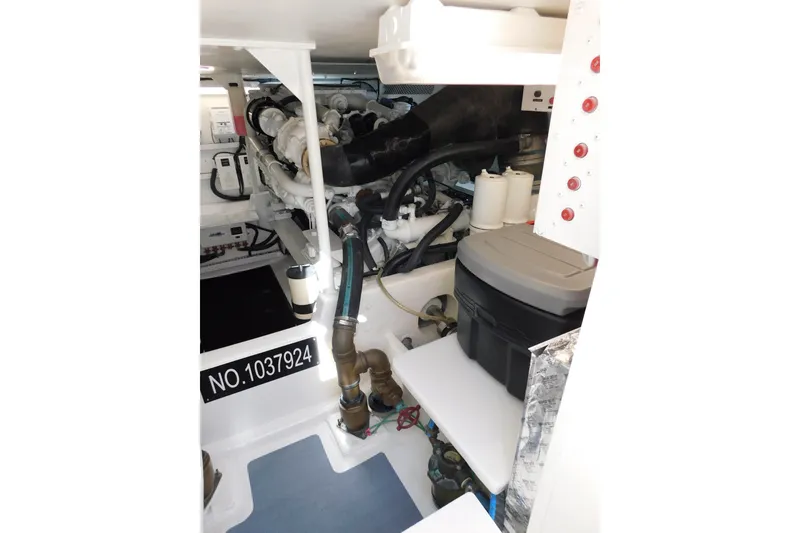Slide: The Image of Engine room of a 1996 Viking 50 Convertible boat, showcasing mechanical components. - 60