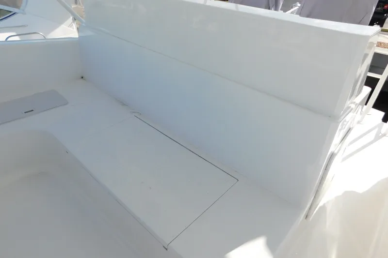 Slide: The Image of White seating area on a 1996 Viking 50 Convertible yacht deck. - 11