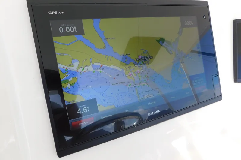 Slide: The Image of Garmin GPS display on 1996 Viking 50 Convertible boat, showing nautical map and depth. - 16