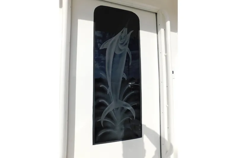 Slide: The Image of Etched marlin design on 1996 Viking 50 Convertible boat door. - 22