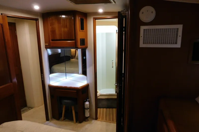 Slide: The Image of Interior of 1996 Viking 50 Convertible yacht with vanity and bathroom. - 56
