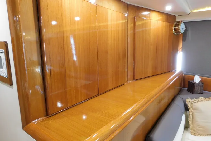 Slide: The Image of Polished wooden interior of 1996 Viking 50 Convertible yacht with seating and decor. - 30