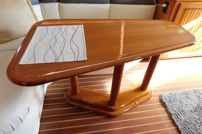 Slide: The Image of Polished wooden table in 1996 Viking 50 Convertible yacht interior. - 28