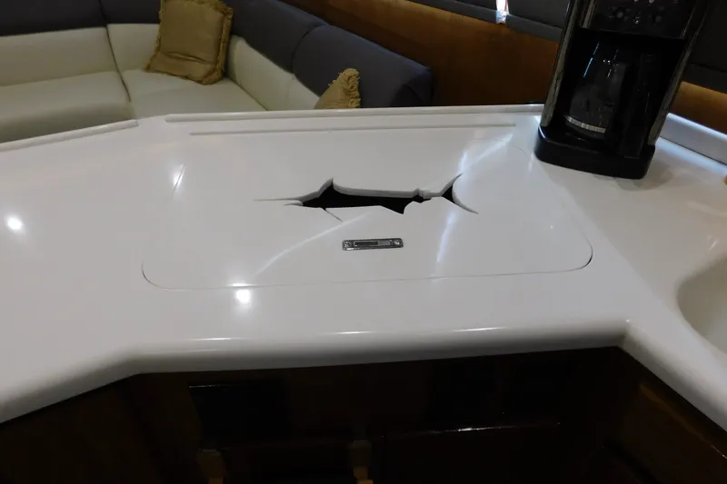 Slide: The Image of Damaged countertop on a 1996 Viking 50 Convertible yacht interior. - 38