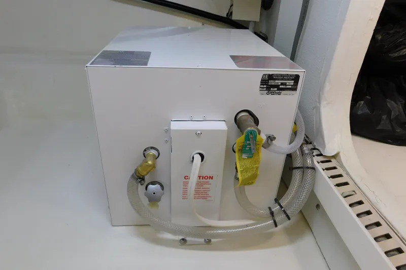 Slide: The Image of Water heater unit in 1996 Viking 50 Convertible boat interior. - 83