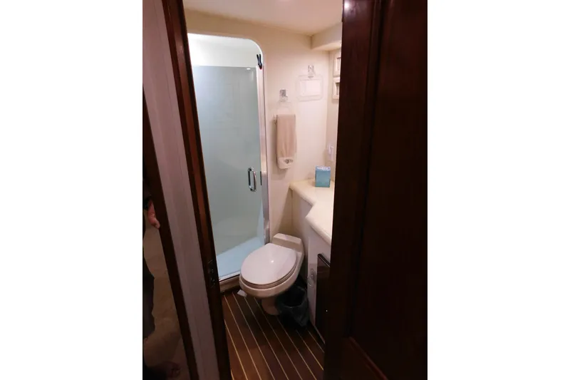 Slide: The Image of Bathroom interior of 1996 Viking 50 Convertible yacht with shower and toilet. - 46