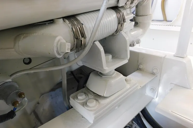 Slide: The Image of Engine compartment of a 1996 Viking 50 Convertible boat, showcasing mechanical components. - 81