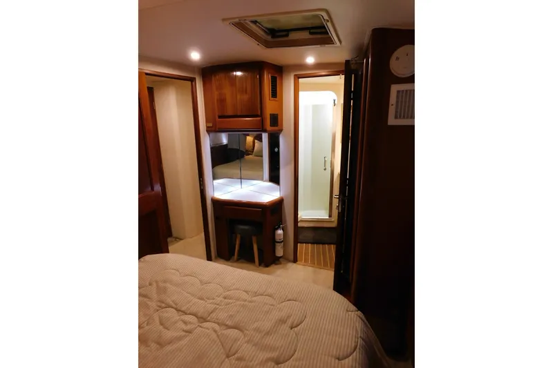 Slide: The Image of Interior of 1996 Viking 50 Convertible yacht with cozy bedroom and bathroom. - 55