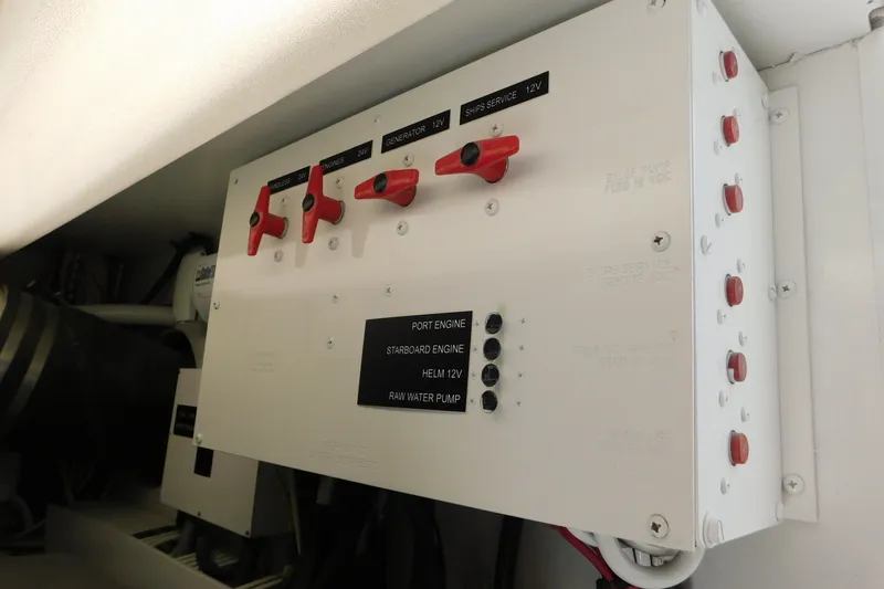 Slide: The Image of Electrical panel on a 1996 Viking 50 Convertible boat with labeled switches and controls. - 75