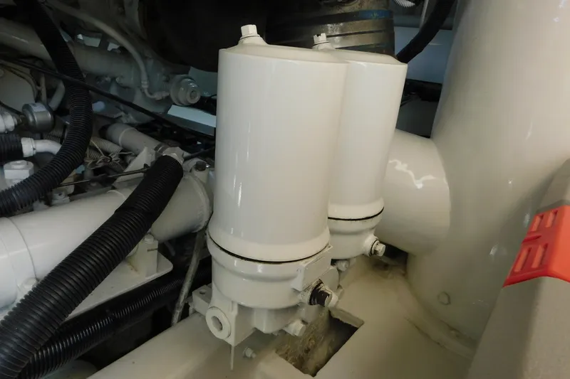 Slide: The Image of Engine compartment of 1996 Viking 50 Convertible yacht, featuring dual white filters. - 73