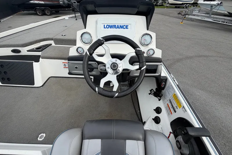 Slide: The Image of 2024 Nitro Z20 boat cockpit with steering wheel and Lowrance electronics. - 19