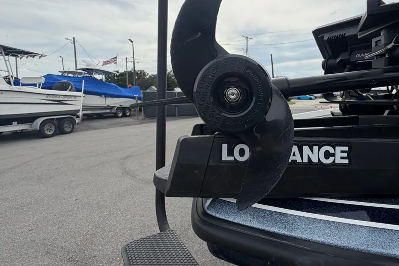 Slide: The Image of 2024 Nitro Z20 boat with Lowrance equipment, featuring a propeller in a marina setting. - 48