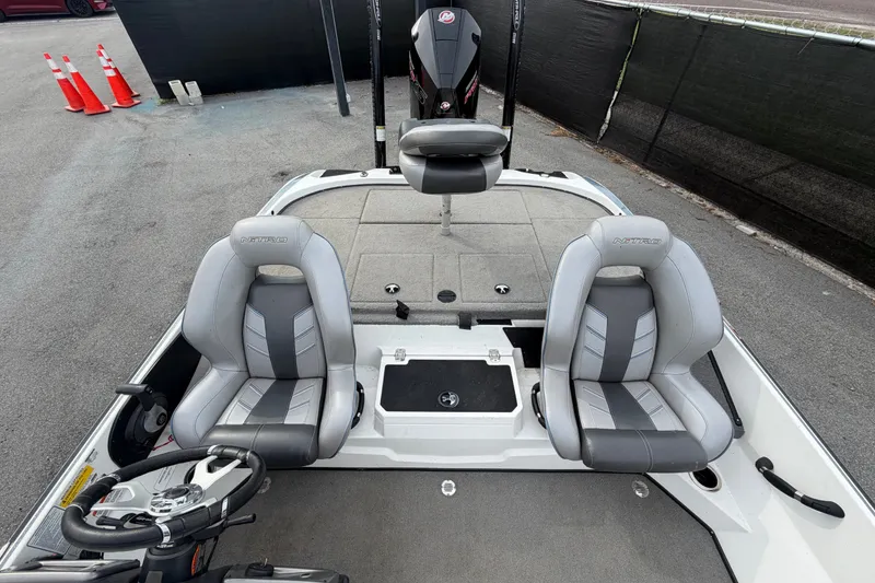Slide: The Image of 2024 Nitro Z20 boat interior with dual seats and steering wheel, showcasing modern design. - 57