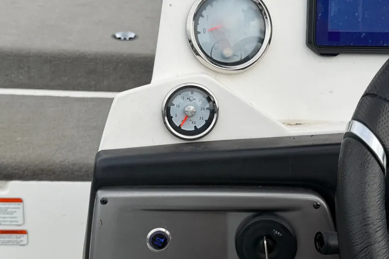 Slide: The Image of Dashboard of a 2024 Nitro Z20 boat featuring gauges and controls. - 23