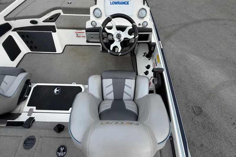 Slide: The Image of 2024 Nitro Z20 boat interior with steering wheel and seating. - 18