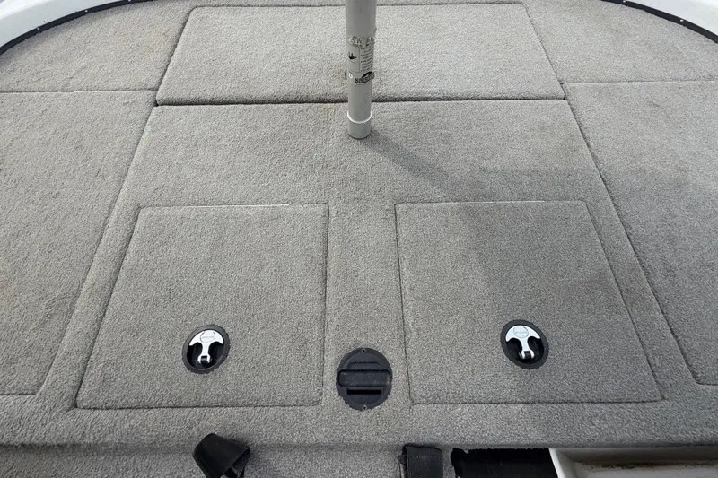Slide: The Image of 2024 Nitro Z20 boat deck with carpeted storage compartments and pole mount. - 66