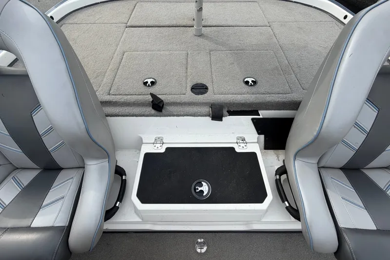 Slide: The Image of 2024 Nitro Z20 boat interior with gray seating and storage compartments. - 60