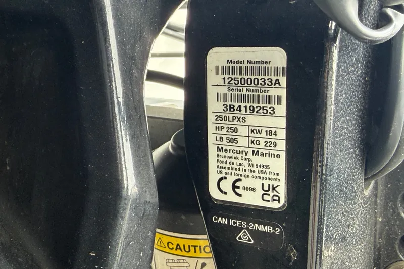 Slide: The Image of Label on Mercury Marine engine, model 250LPXS, showing specifications and serial number. - 84